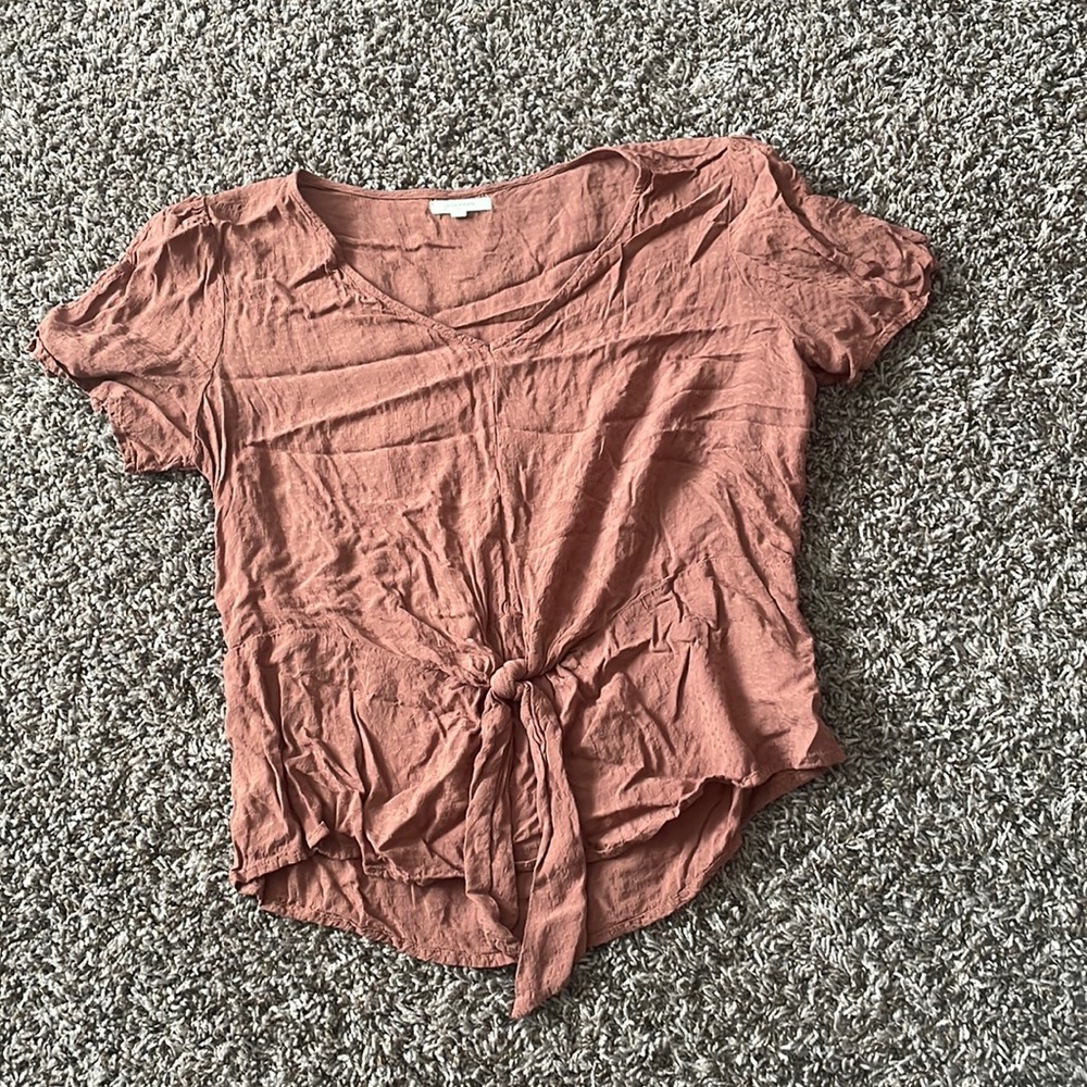 Blush, tie blouse from Maurice’s